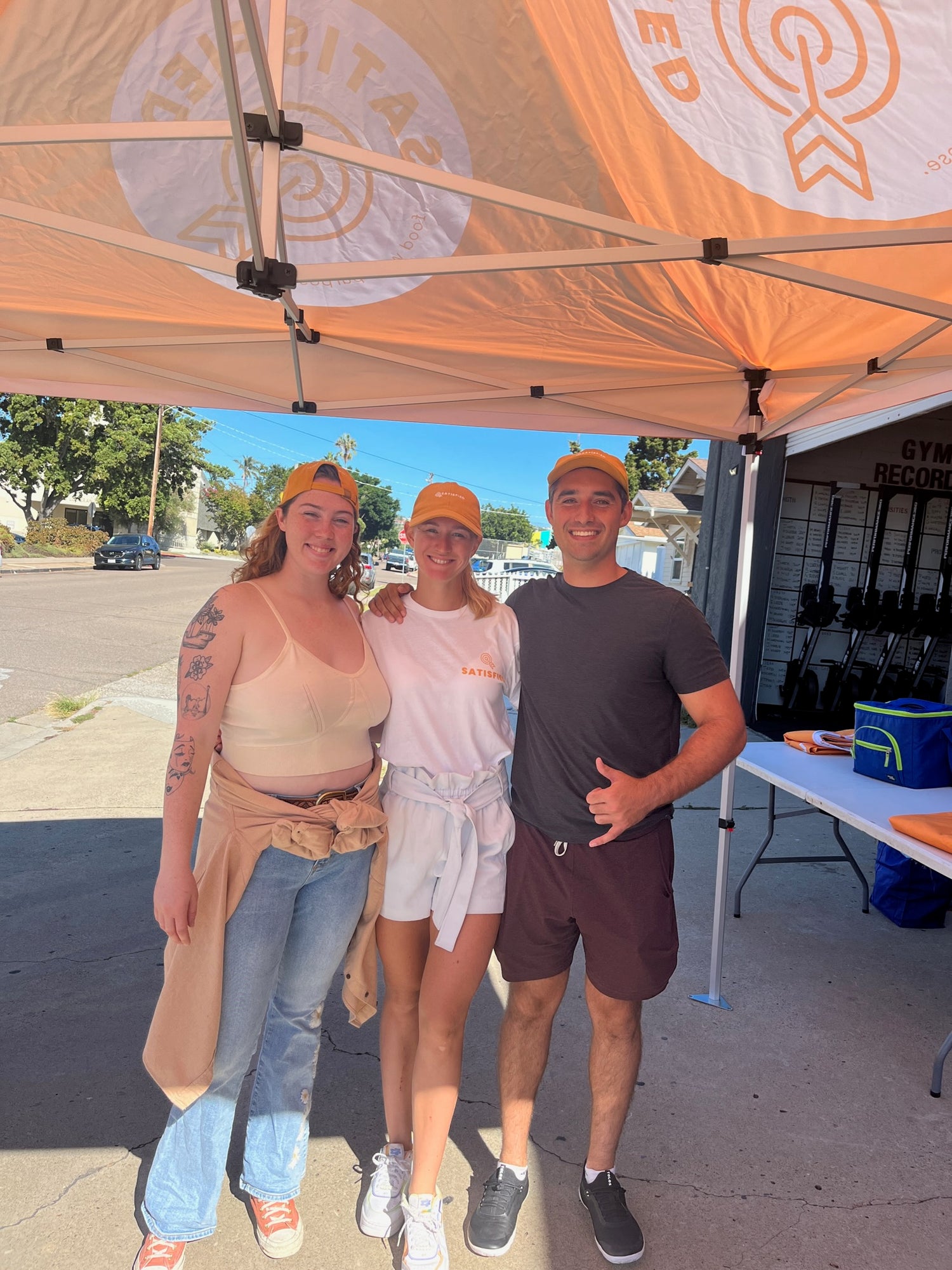 Anna, Karoline, and Javon all pose for photo outside performance 360 PB